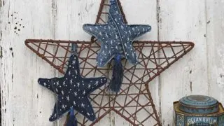 embroidered fabric stars in denim feature