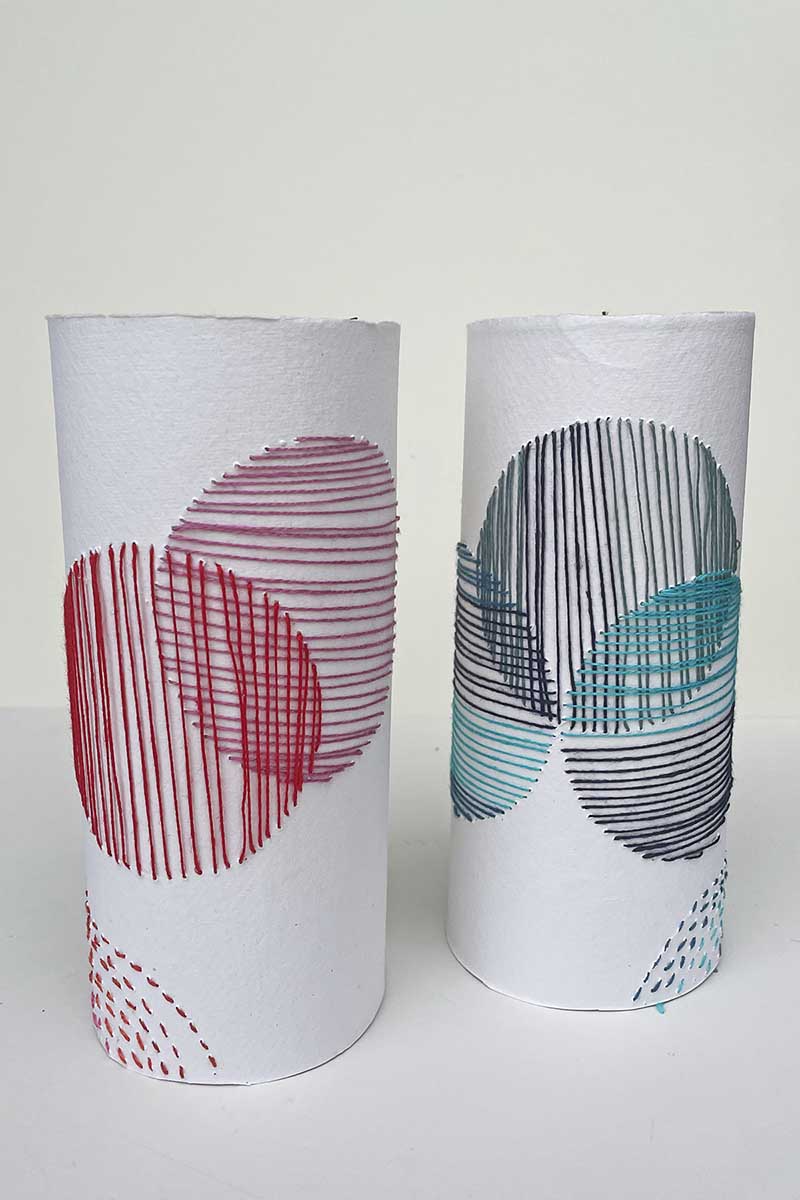 Pair of paper embroidered vase sleeves