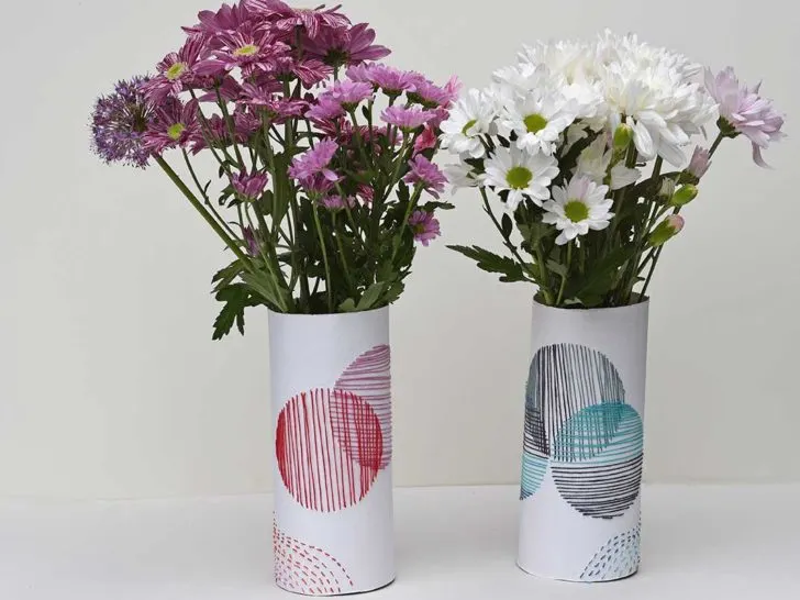 pair of hand embroidered paper sleeve vases with flowers