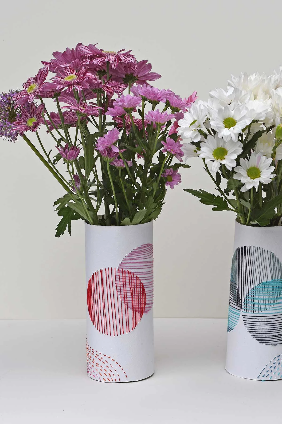 Pair of embroidered paper vases