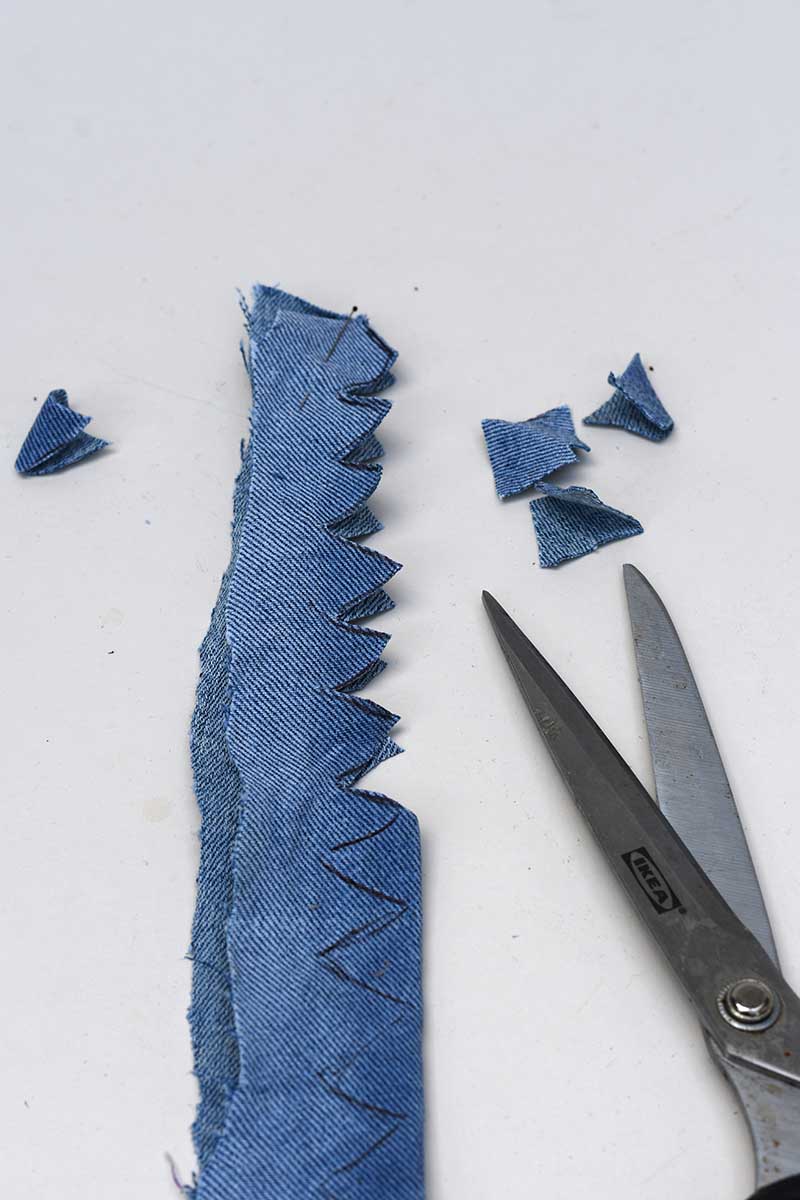 cutting out the zig zag fabric thistle leaves