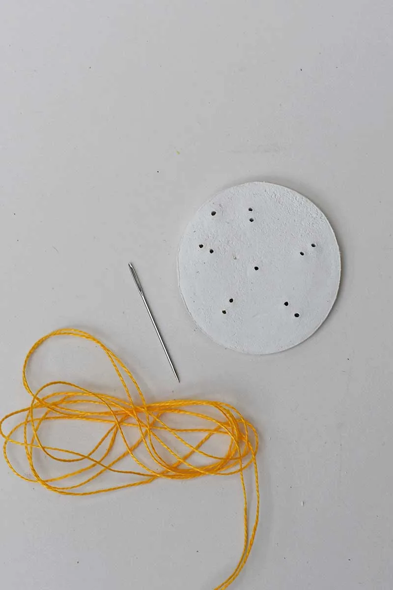 embroidering clay lazy daisy design