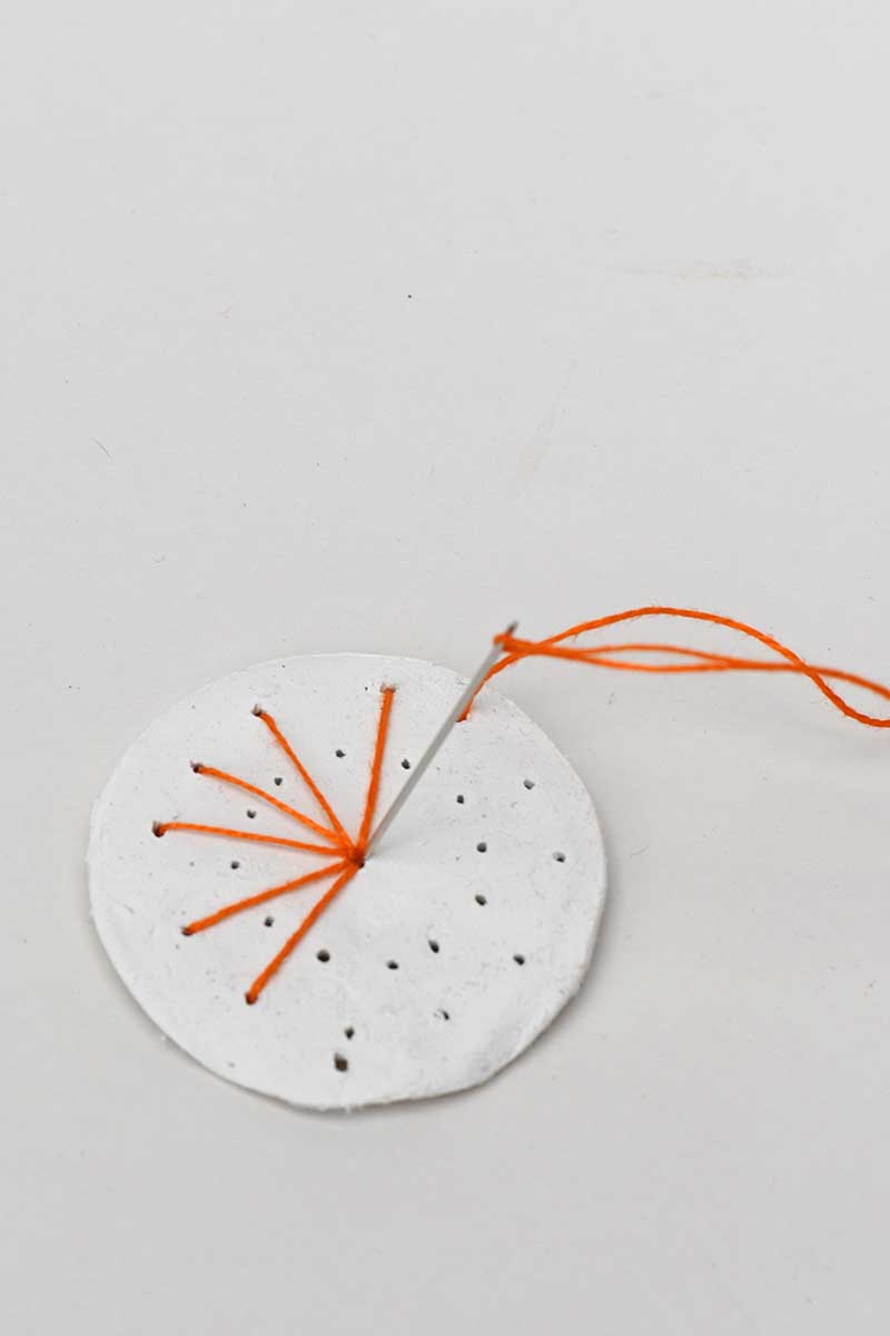 embroidering sunburst on air dry clay