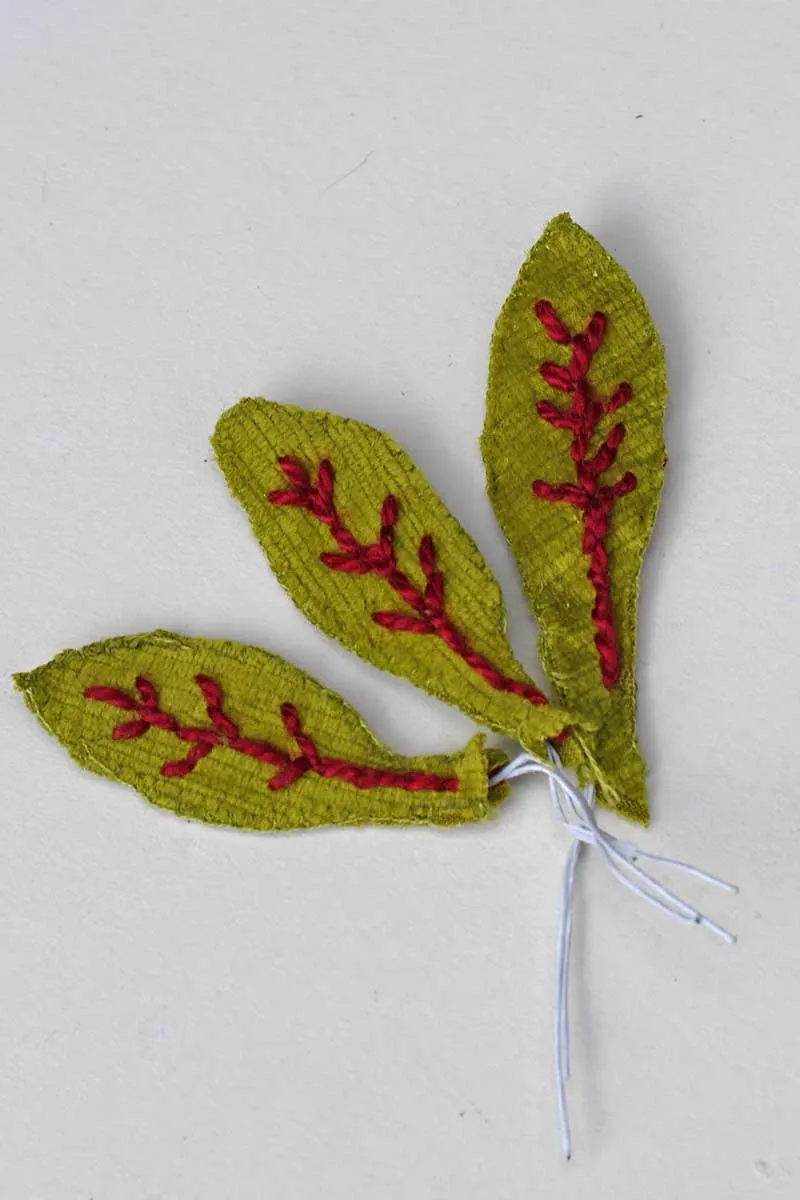 Three hand stitched beetroot leaves for a handmade brooch