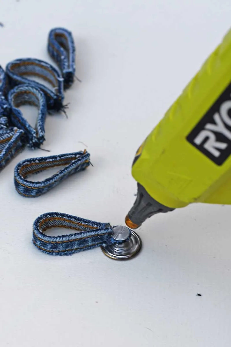 gluing belt loops to the underside of jeans button