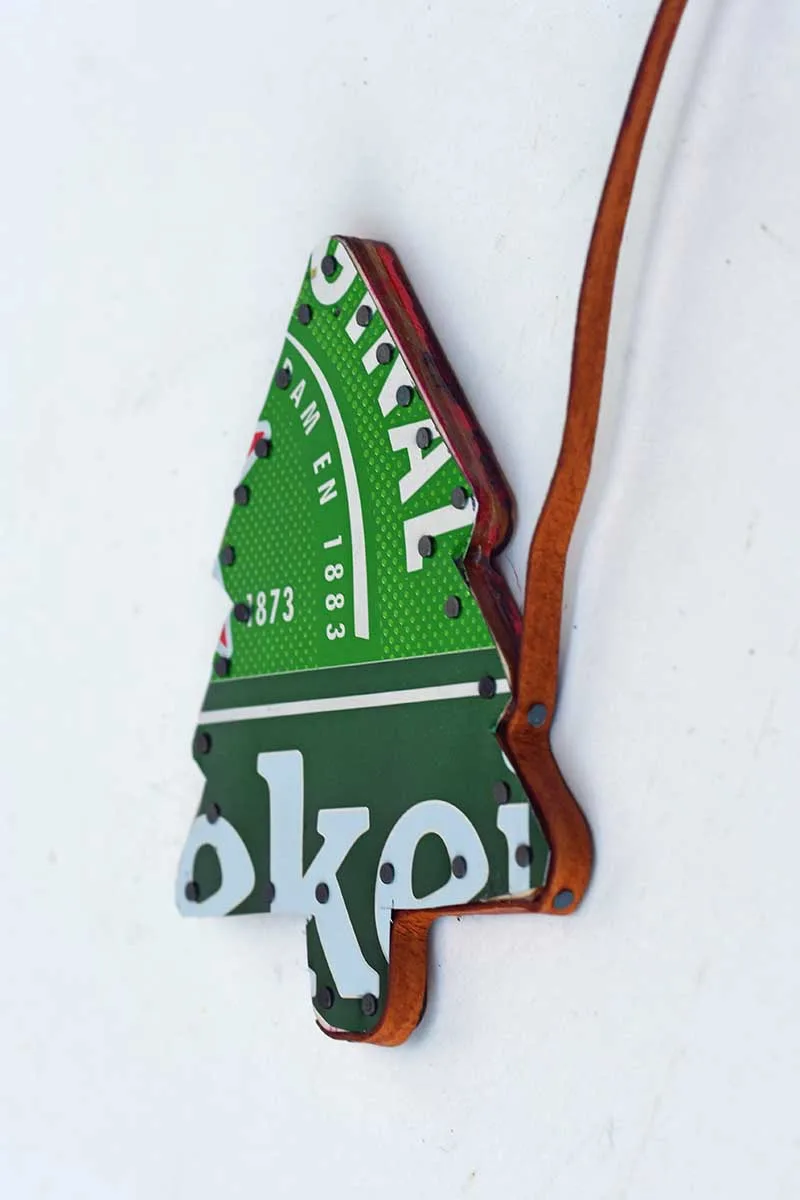 adding leather trim to the edge of soda can Christmas tree ornament