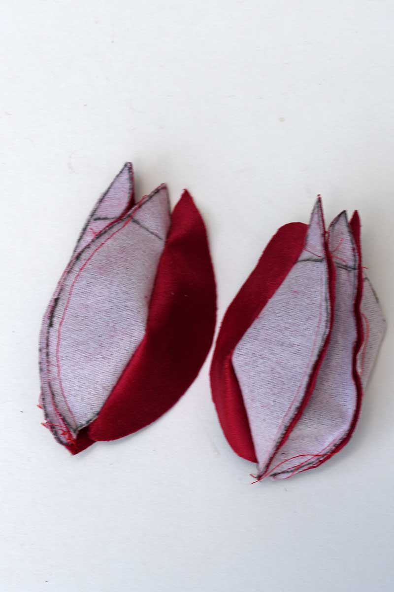 stitching the velvet pomegranate inside out.