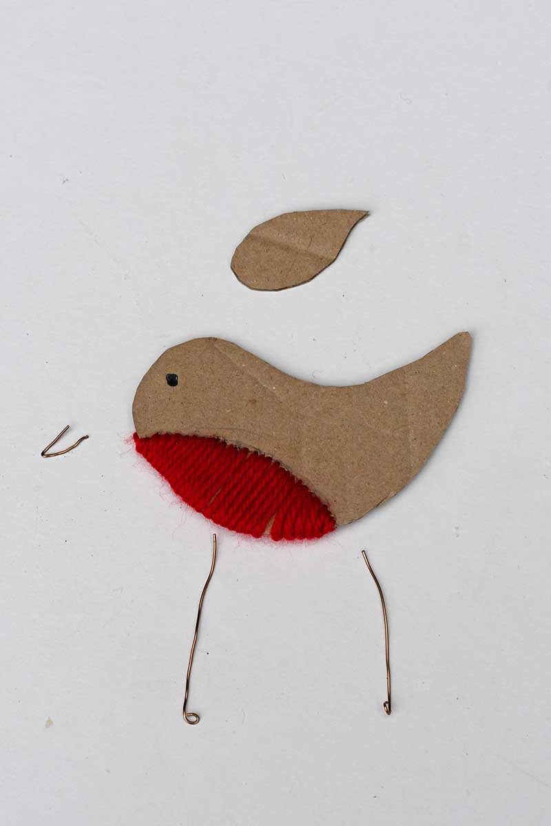 making wire feet and beak for a cardboard robin ornament