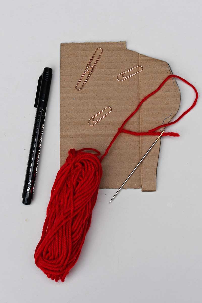 cardboard wool pen and paper clips