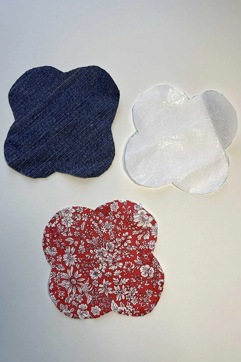 3 cut out fabric pieces for DIY fabric heart pockets