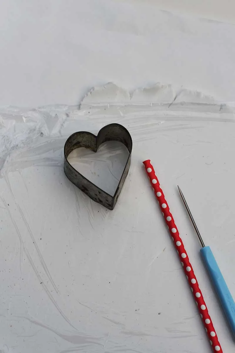 heart cookie cutter rolled out air dry clay and straw