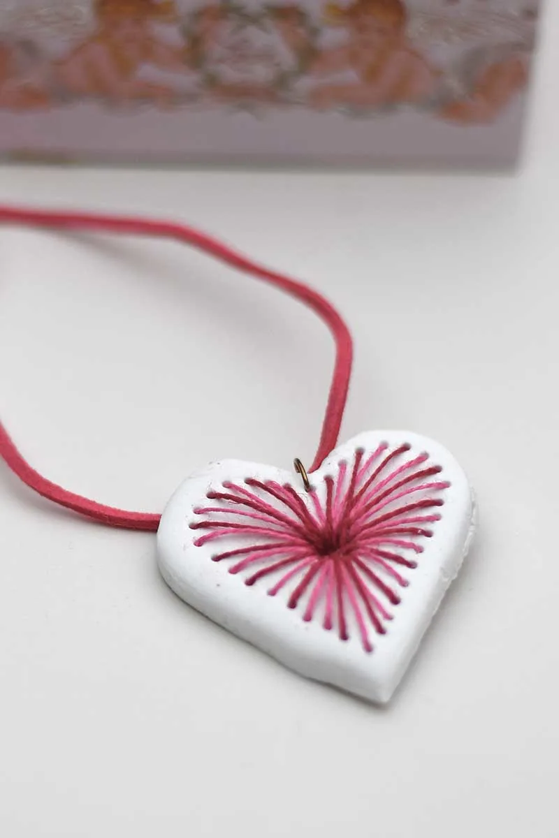 pink and red embroidered clay pendant necklace