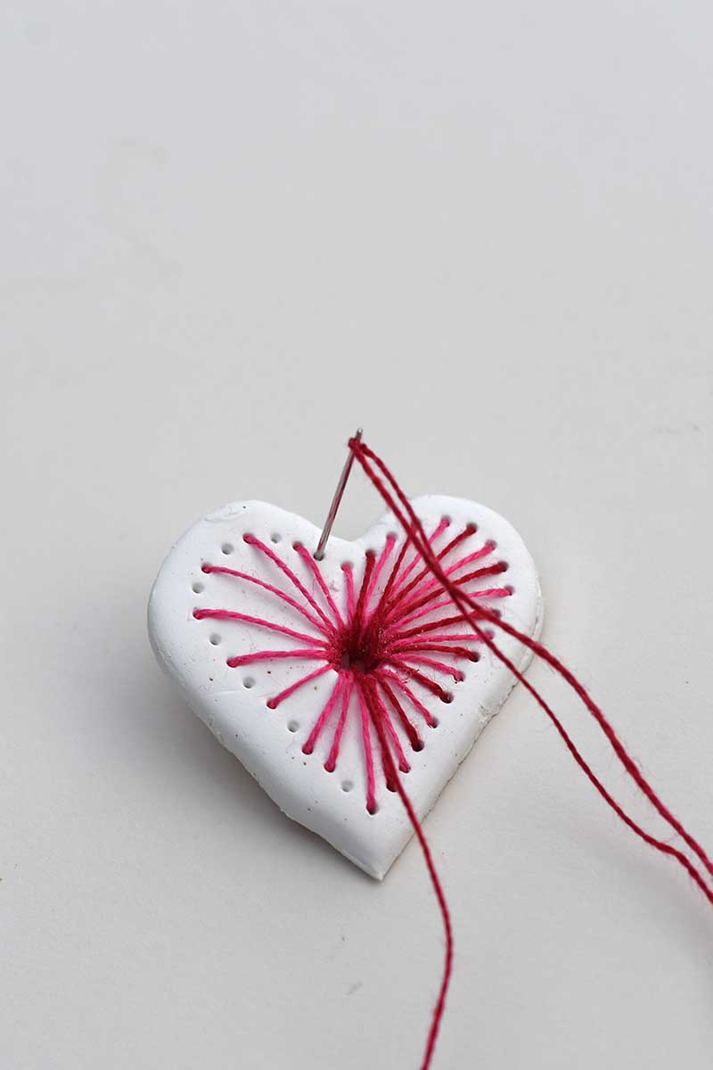 stitching the clay heart