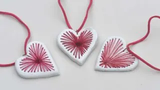 three red and pink embroidered air dry clay heart pendant necklaces