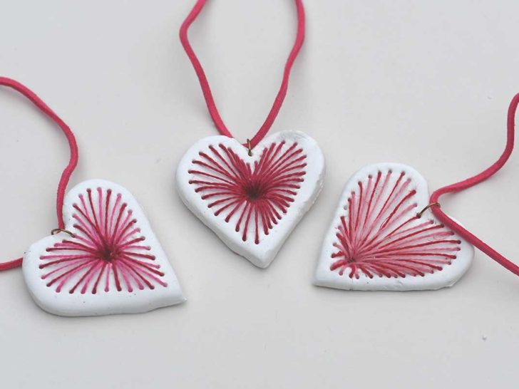 three red and pink embroidered air dry clay heart pendant necklaces